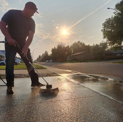 joel doing driveway maintenance